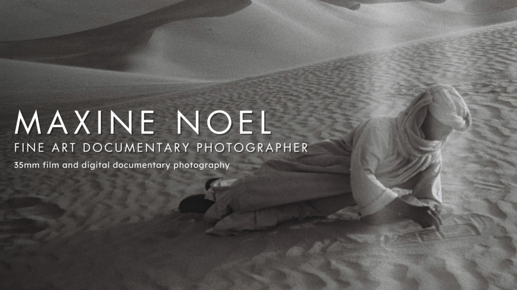 Tuareg figure resting in the Sahara desert, Djanet Algeria, black and white film photography